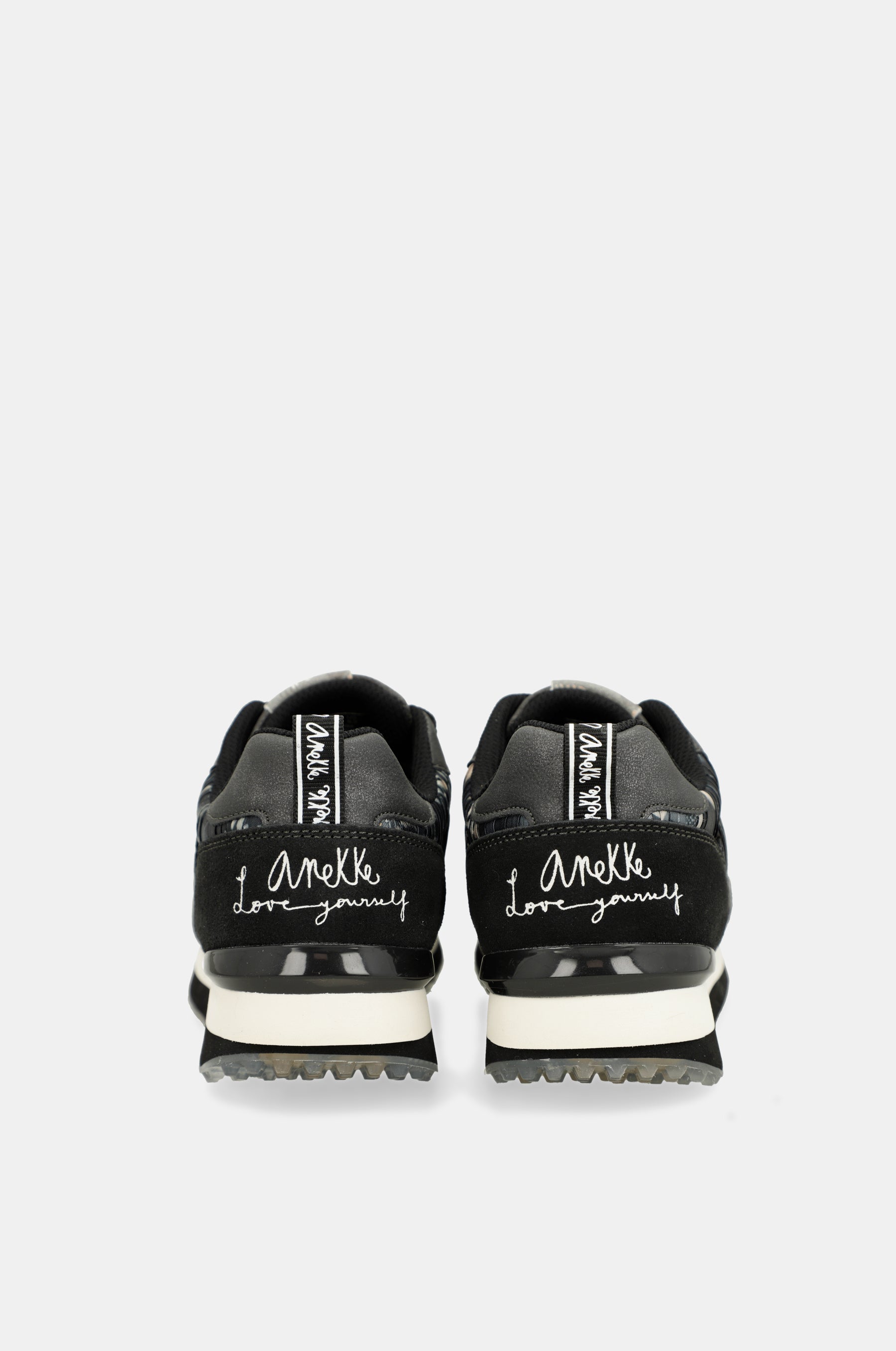 Black sneakers with multicoloured sole